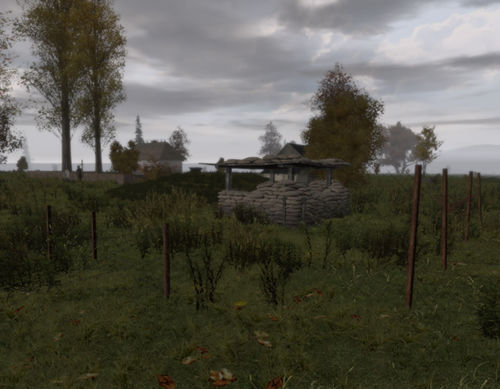 An infantry fortification - sandbags, earthworks and wire.